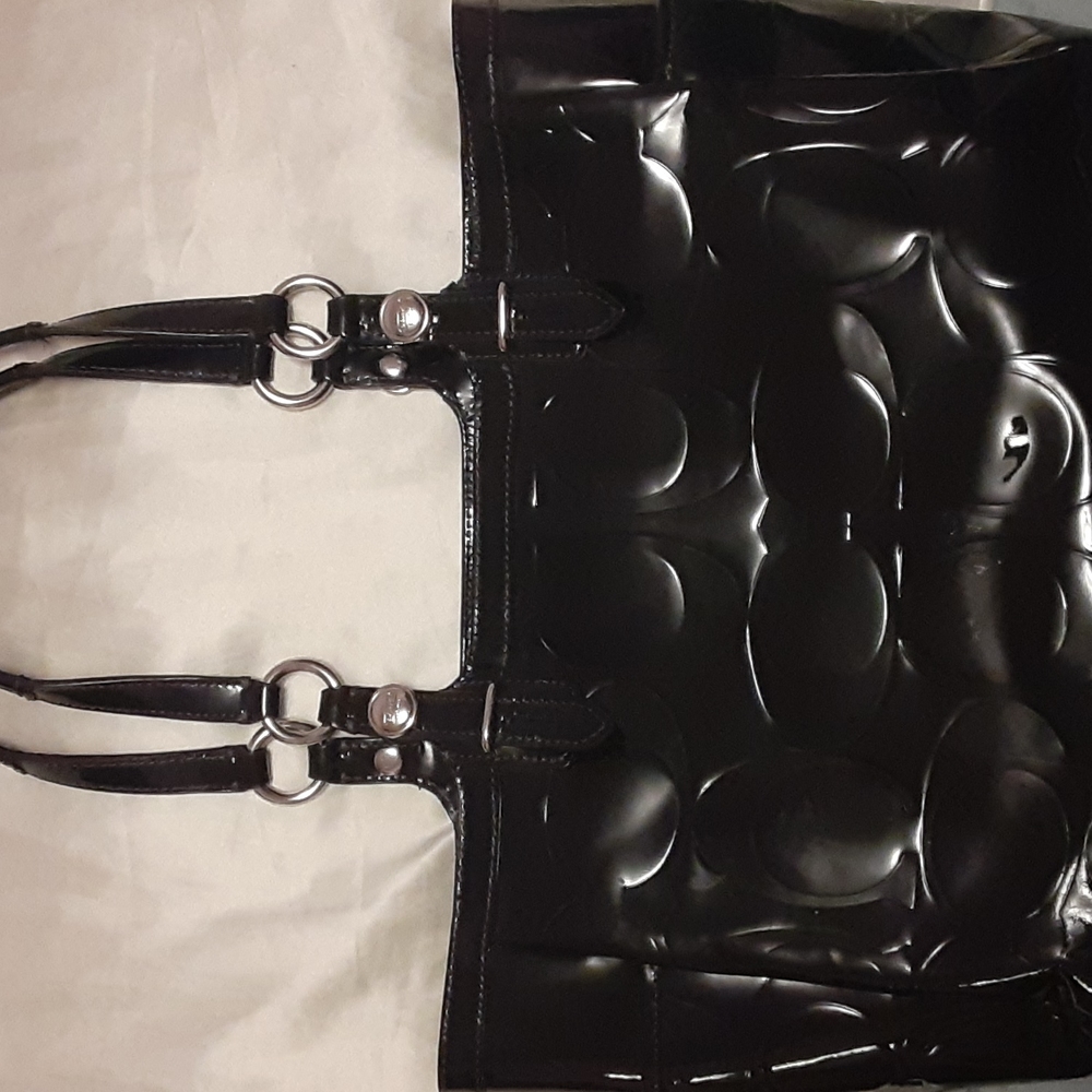 Medium Coach bag.  Some flaws outside.